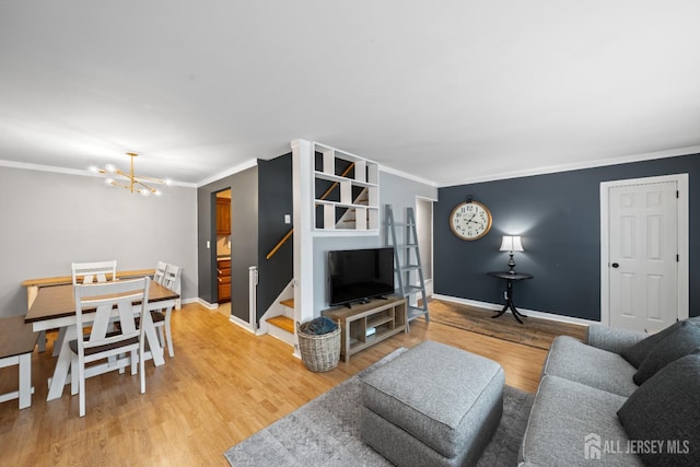 6 Linda Ave, Colonia, NJ 07067 - living area featuring crown molding, a chandelier, stairs, and light wood-type flooring