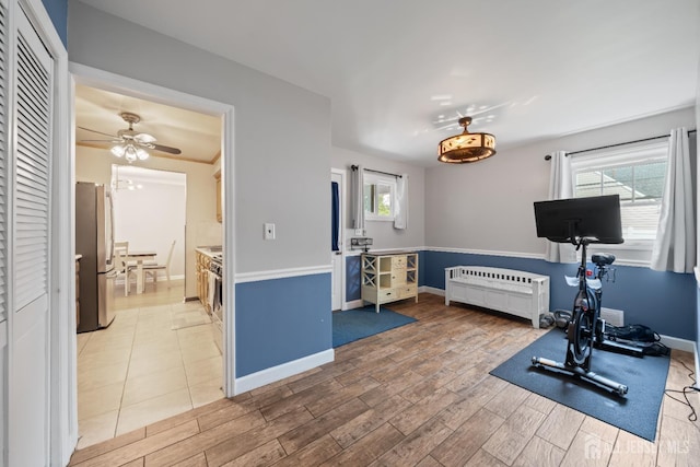 6 Linda Ave, Colonia, NJ 07067 - exercise area featuring radiator, plenty of natural light, a ceiling fan, and light wood-style floors