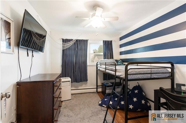 47 Dewitt Ter, Colonia, NJ 07067 - bedroom with a baseboard radiator and wood finished floors