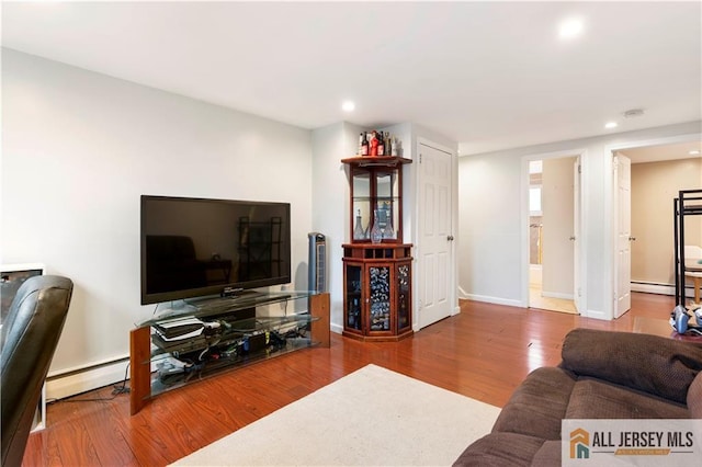 47 Dewitt Ter, Colonia, NJ 07067 - living area featuring recessed lighting, wood finished floors, and a baseboard radiator