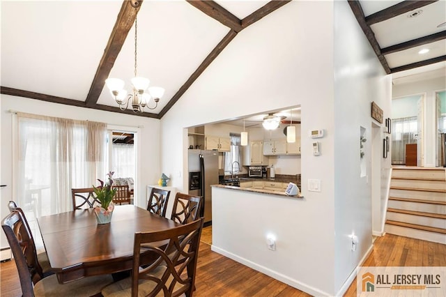 47 Dewitt Ter, Colonia, NJ 07067 - dining space featuring dark wood-style flooring, a chandelier, and stairway