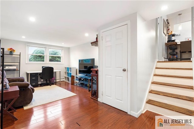 47 Dewitt Ter, Colonia, NJ 07067 - living area with an office area, wood finished floors, stairway, recessed lighting, and baseboard heating