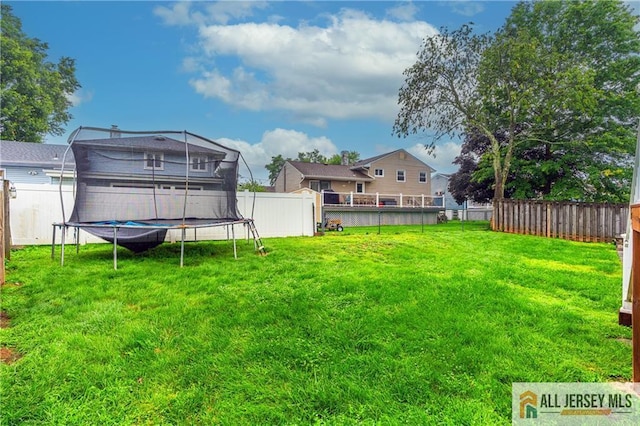 47 Dewitt Ter, Colonia, NJ 07067 - fenced backyard with a trampoline