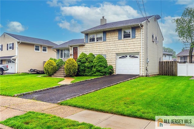 47 Dewitt Ter, Colonia, NJ 07067 - split level home with a chimney, a garage, and asphalt driveway
