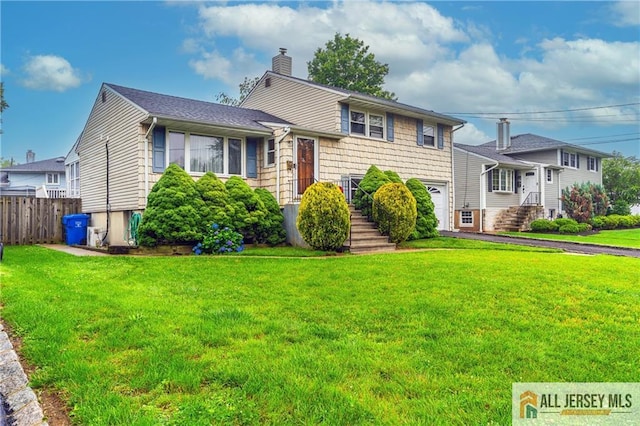 47 Dewitt Ter, Colonia, NJ 07067 - tri-level home featuring a chimney and driveway