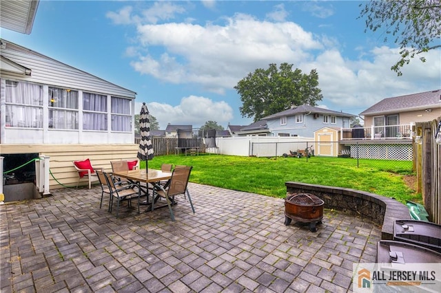 47 Dewitt Ter, Colonia, NJ 07067 - fenced backyard with an outdoor fire pit, a patio, and a trampoline