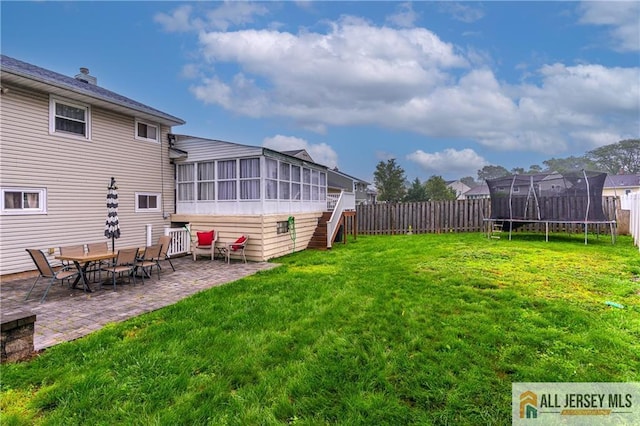 47 Dewitt Ter, Colonia, NJ 07067 - fenced backyard with a trampoline, a sunroom, a patio area, and stairs