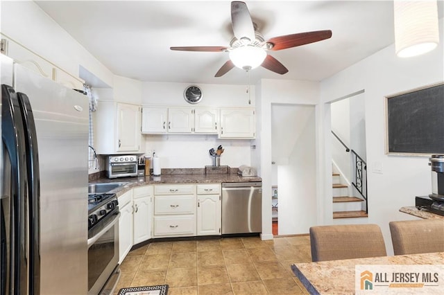 47 Dewitt Ter, Colonia, NJ 07067 - kitchen with appliances with stainless steel finishes, a ceiling fan, white cabinetry, and light tile patterned floors