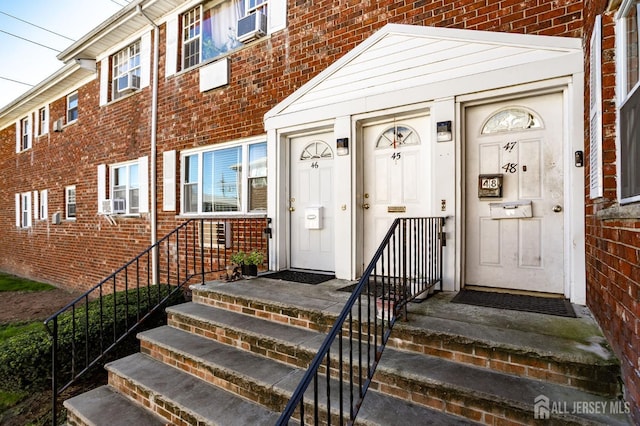 property entrance with brick siding