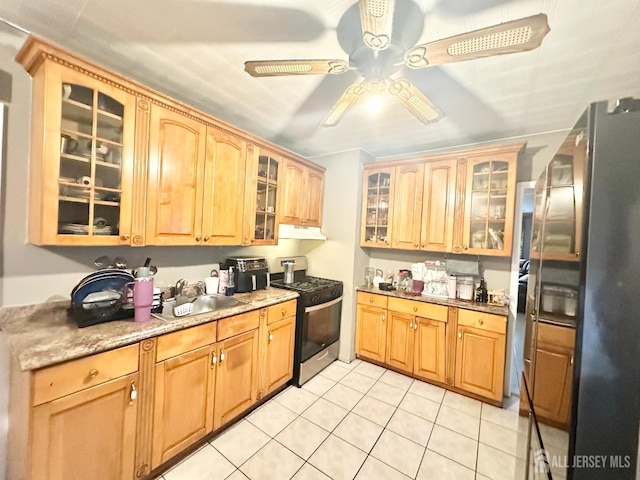44 S Ward St, New Brunswick, NJ 08901 - kitchen featuring stainless steel range with gas cooktop, freestanding refrigerator, under cabinet range hood, a ceiling fan, and light tile patterned floors