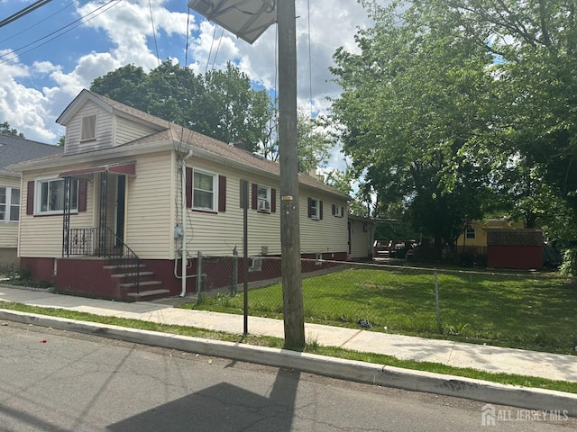 view of front of property featuring roof with shingles