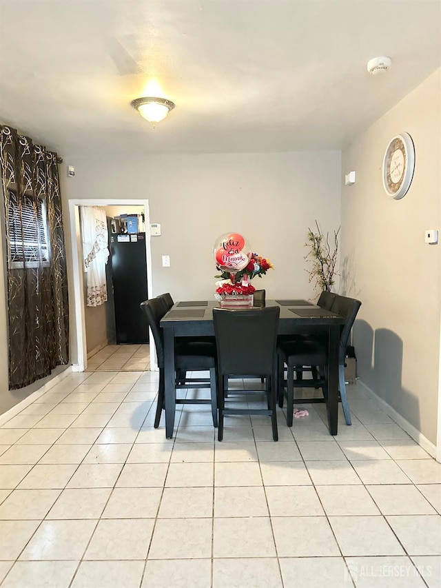 44 S Ward St, New Brunswick, NJ 08901 - dining area featuring light tile patterned floors and baseboards