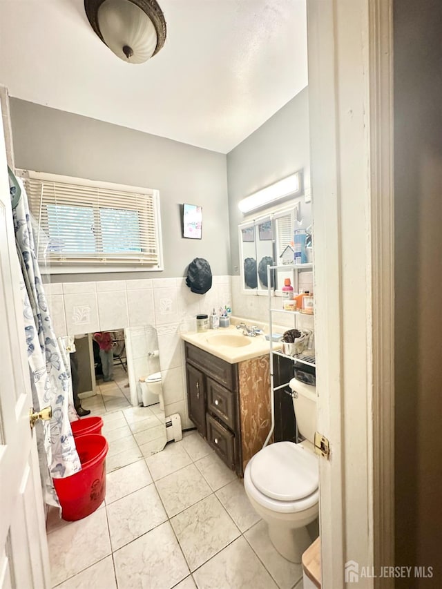44 S Ward St, New Brunswick, NJ 08901 - bathroom featuring tile walls, vanity, tile patterned floors, and a wainscoted wall