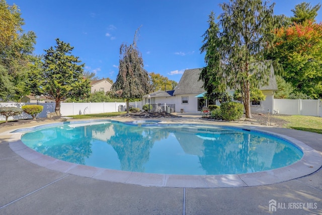 view of pool with a patio, a fenced in pool, and a fenced backyard