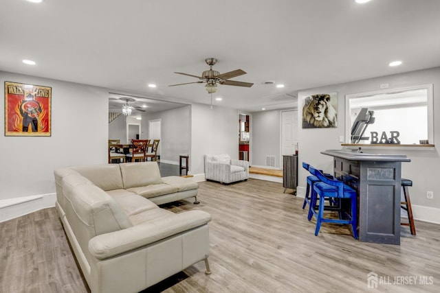 living area with wood finished floors, baseboards, visible vents, recessed lighting, and ceiling fan