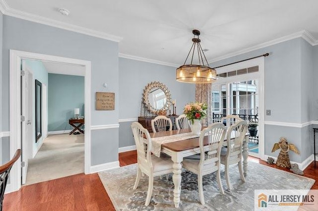 7203 Minuteman Ln, Franklin, NJ 08873 - dining area featuring wood finished floors, crown molding, and a chandelier
