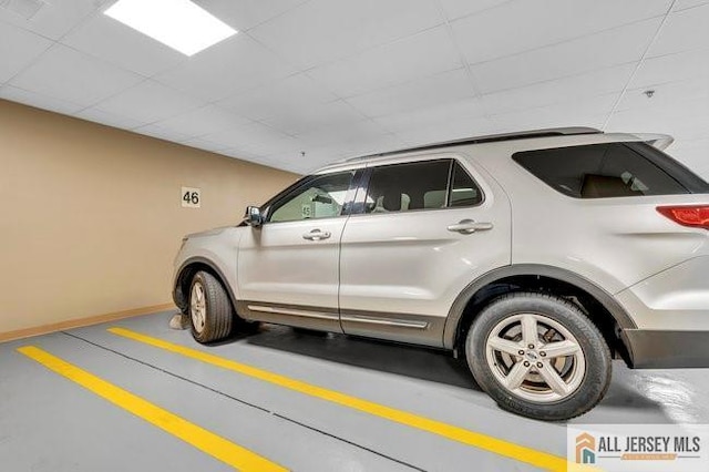 7203 Minuteman Ln, Franklin, NJ 08873 - garage featuring baseboards