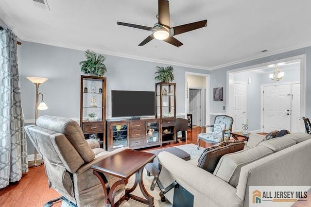 7203 Minuteman Ln, Franklin, NJ 08873 - living area with a ceiling fan, wood finished floors, and crown molding