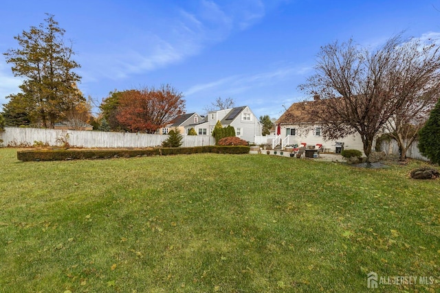 view of yard featuring a patio area and fence