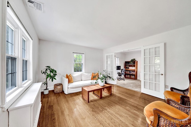 10 Shaw Dr, Franklin, NJ 08528 - living room featuring french doors and wood finished floors