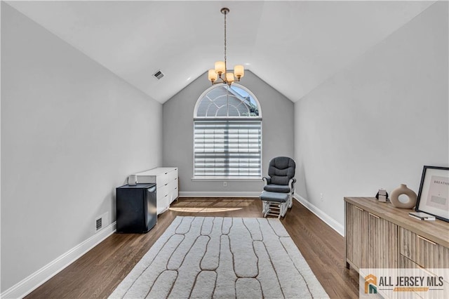 11 Hawk Ct, East Brunswick, NJ 08816 - sitting room featuring a chandelier, vaulted ceiling, and wood finished floors