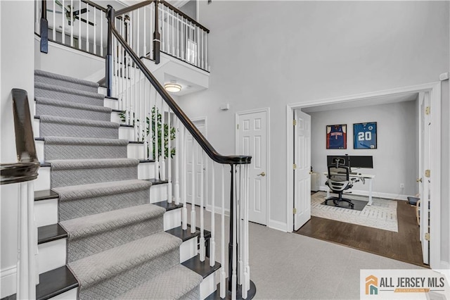 11 Hawk Ct, East Brunswick, NJ 08816 - stairs featuring a high ceiling and tile patterned floors