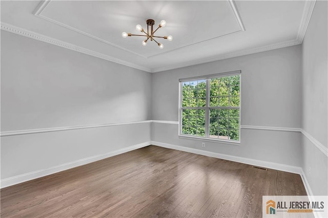 11 Hawk Ct, East Brunswick, NJ 08816 - unfurnished room featuring wood finished floors, crown molding, and a chandelier