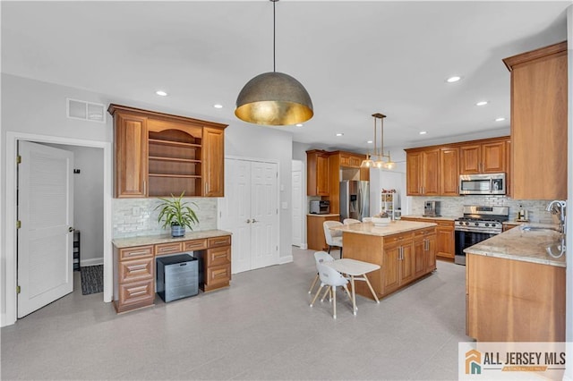 11 Hawk Ct, East Brunswick, NJ 08816 - kitchen with appliances with stainless steel finishes, decorative backsplash, open shelves, brown cabinetry, and recessed lighting