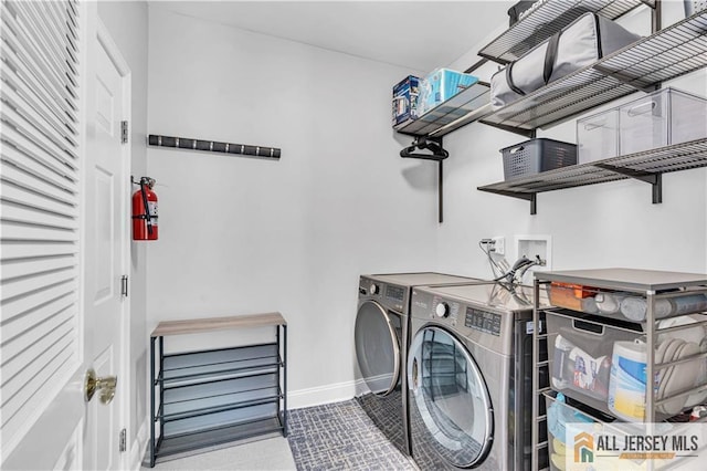 11 Hawk Ct, East Brunswick, NJ 08816 - washroom with washing machine and clothes dryer and baseboards