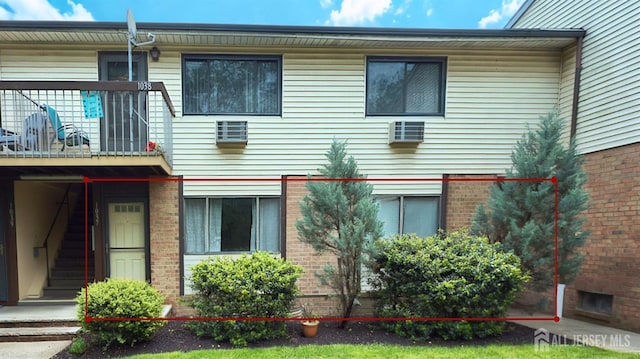 1037 Cricket Ln, Woodbridge Proper, NJ 07095 - back of house with a balcony and brick siding