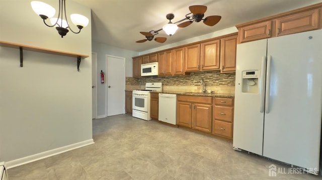 1037 Cricket Ln, Woodbridge Proper, NJ 07095 - kitchen with white appliances, decorative backsplash, ceiling fan, brown cabinets, and light stone countertops