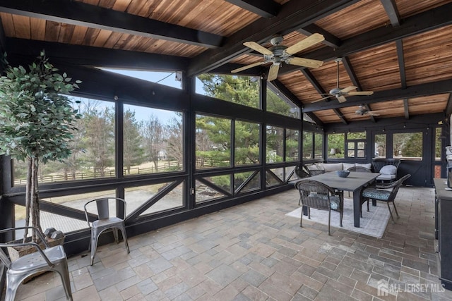 sunroom with wooden ceiling, vaulted ceiling with beams, and ceiling fan