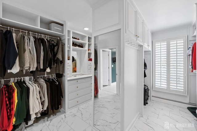 spacious closet featuring marble finish floor