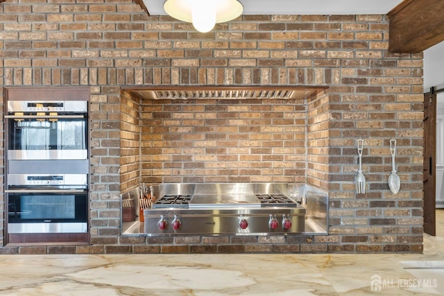 13 Eagle Nest Rd, Colts Neck, NJ 07722 - kitchen view of appliances with stainless steel finishes and brick wall