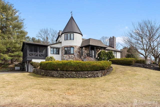 13 Eagle Nest Rd, Colts Neck, NJ 07722 - view of front of house featuring a sunroom, stone siding, a front lawn, and a chimney