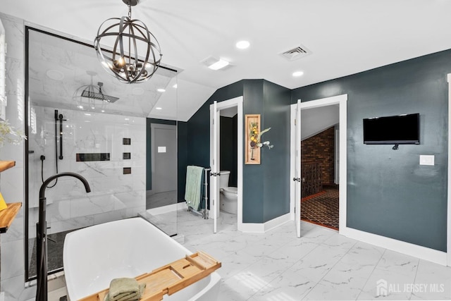 bathroom featuring a freestanding tub, visible vents, toilet, marble finish floor, and baseboards