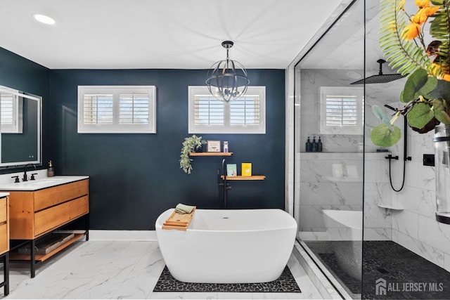 bathroom featuring walk in shower, baseboards, a freestanding tub, marble finish floor, and vanity