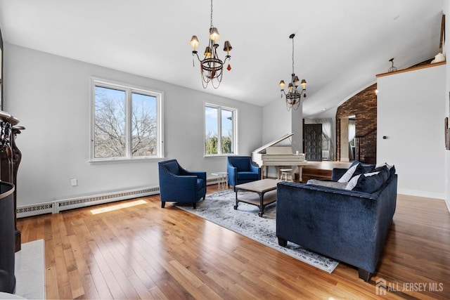 living room with vaulted ceiling, a notable chandelier, hardwood / wood-style flooring, and a baseboard radiator