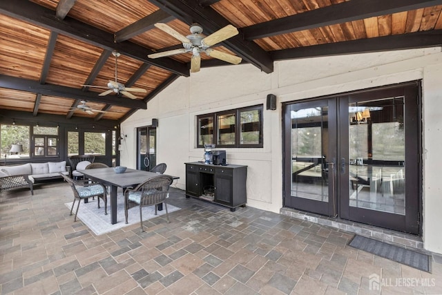 view of patio / terrace with ceiling fan, french doors, an outdoor hangout area, and outdoor dining space