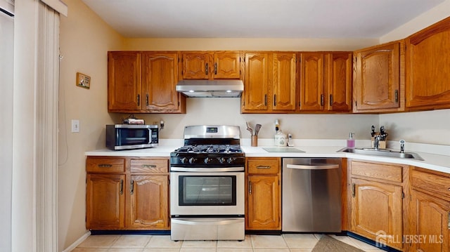 1406 Locust Ct, South Brunswick, NJ 08852 - kitchen featuring stainless steel appliances, under cabinet range hood, brown cabinets, and light countertops
