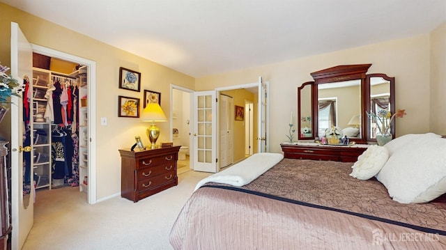 1406 Locust Ct, South Brunswick, NJ 08852 - bedroom with a spacious closet, a closet, carpet flooring, ensuite bathroom, and french doors