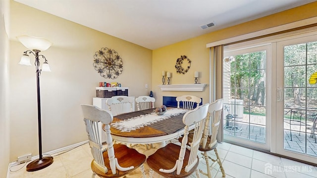 1406 Locust Ct, South Brunswick, NJ 08852 - dining space featuring light tile patterned flooring and a fireplace