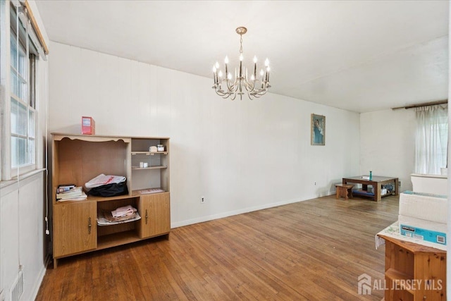 796 Curie Rd, North Brunswick, NJ 08902 - dining area with wood-type flooring and a chandelier