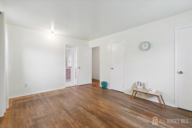796 Curie Rd, North Brunswick, NJ 08902 - empty room featuring wood-type flooring and baseboards