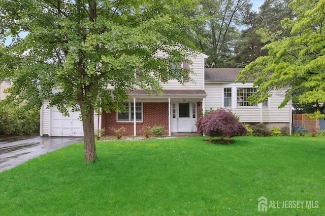796 Curie Rd, North Brunswick, NJ 08902 - view of front of property featuring asphalt driveway, a front lawn, and an attached garage