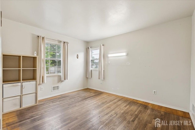 796 Curie Rd, North Brunswick, NJ 08902 - empty room featuring wood finished floors and baseboards