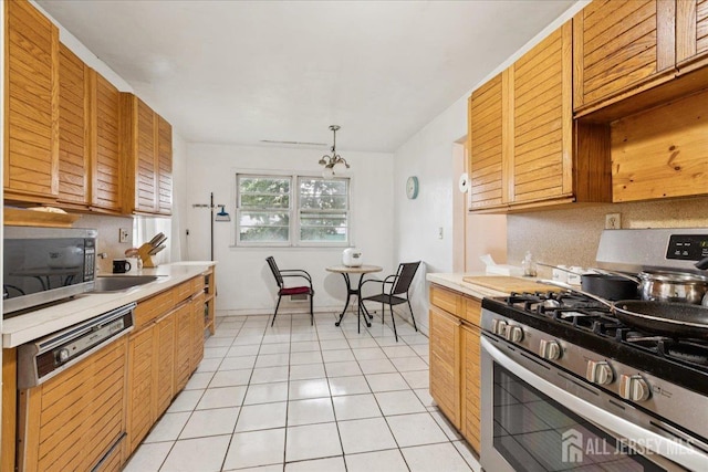 796 Curie Rd, North Brunswick, NJ 08902 - kitchen featuring appliances with stainless steel finishes, light countertops, light tile patterned floors, and decorative backsplash