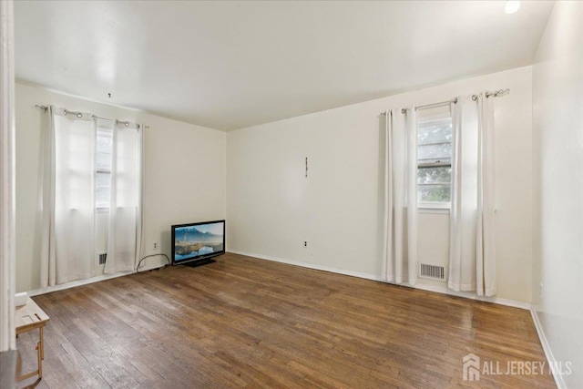 796 Curie Rd, North Brunswick, NJ 08902 - empty room featuring wood finished floors and healthy amount of natural light