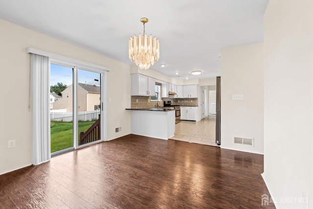 96 Lark Dr, South River, NJ 08882 - unfurnished living room featuring a chandelier, light wood-type flooring, and recessed lighting