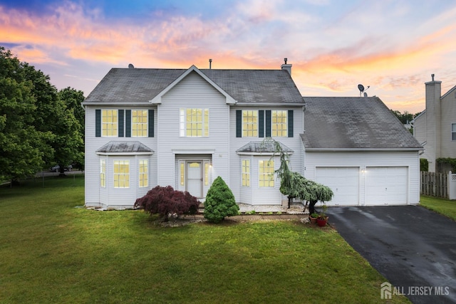 96 Lark Dr, South River, NJ 08882 - colonial inspired home with an attached garage, driveway, a chimney, and a shingled roof